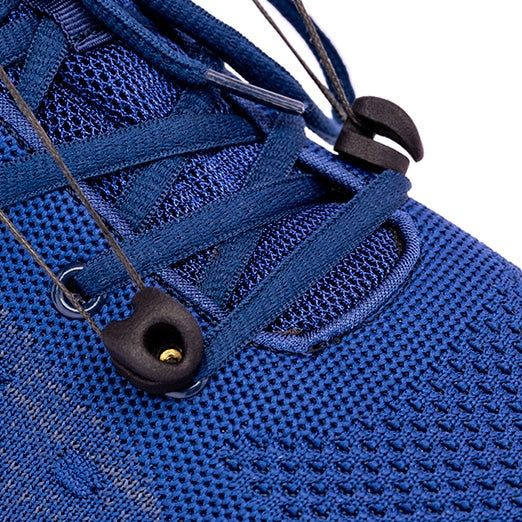 Closeup of SaeboStep foot drop brace front cords attached to blue sneaker eyelets.