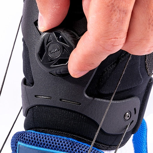 One hand adjusting the dial for the lift angle of the SaeboStep AFO foot drop brace.