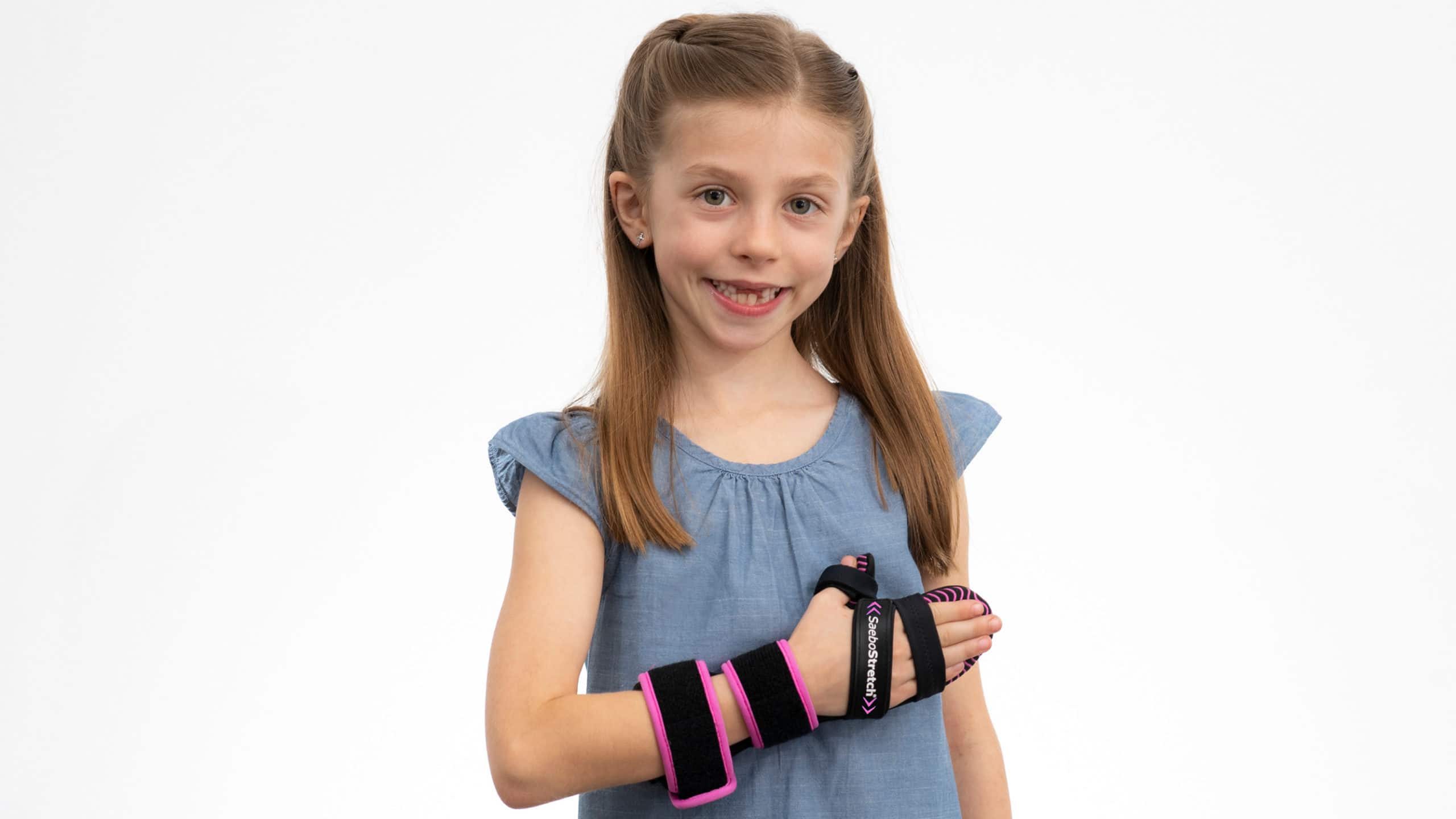 Pediatric SaeboStretch in Pink worn by a girl