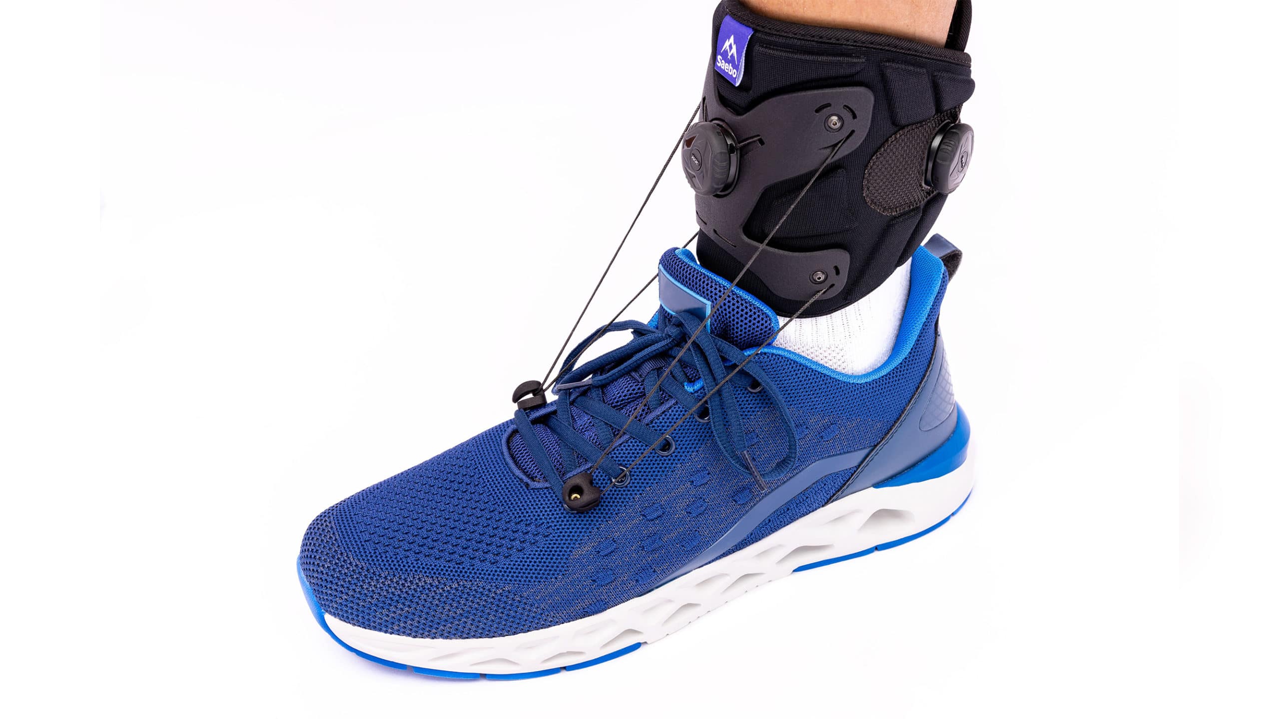 SaeboStep Foot Drop Brace with blue running shoe
